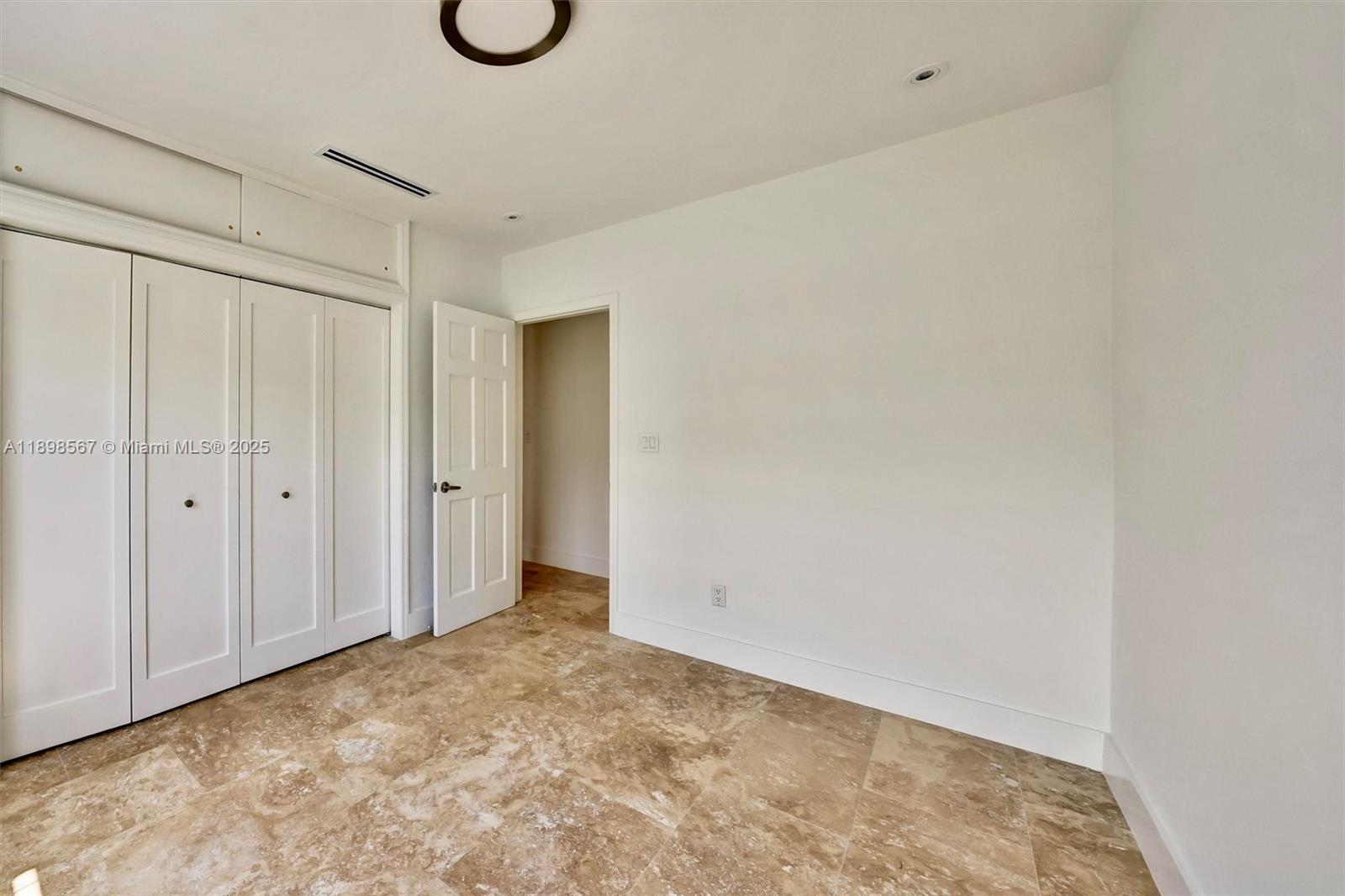 255 Ridgewood Road Key Biscayne, FL 33149 - Photo 40 of 55 a view of an empty room