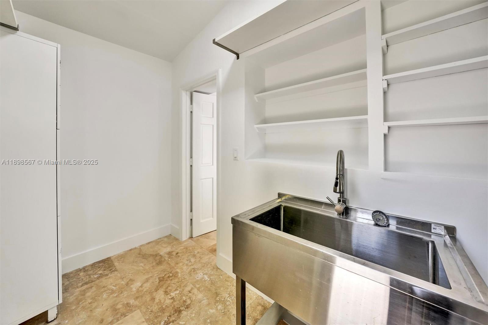 255 Ridgewood Road Key Biscayne, FL 33149 - Photo 42 of 55 a close view of sink and tap