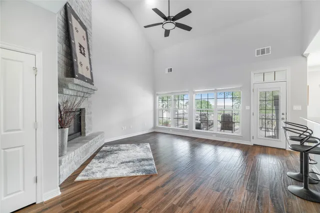 a view of kitchen with furniture and refrigerator