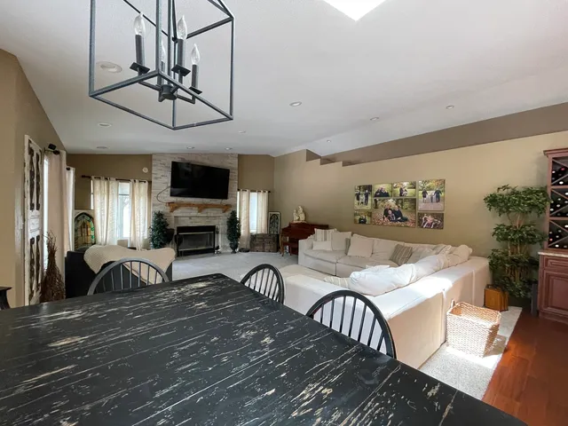 a living room with furniture fireplace and flat screen tv