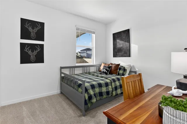 a bedroom with bed and a night stand