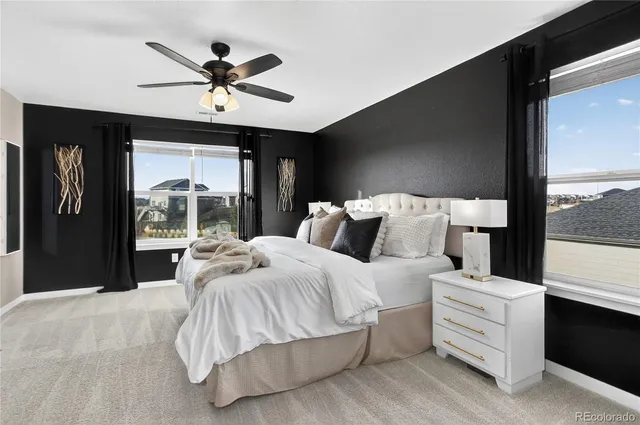 a bed room with a bed and a window