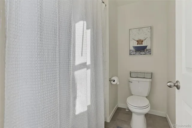 a bathroom with a toilet and a sink