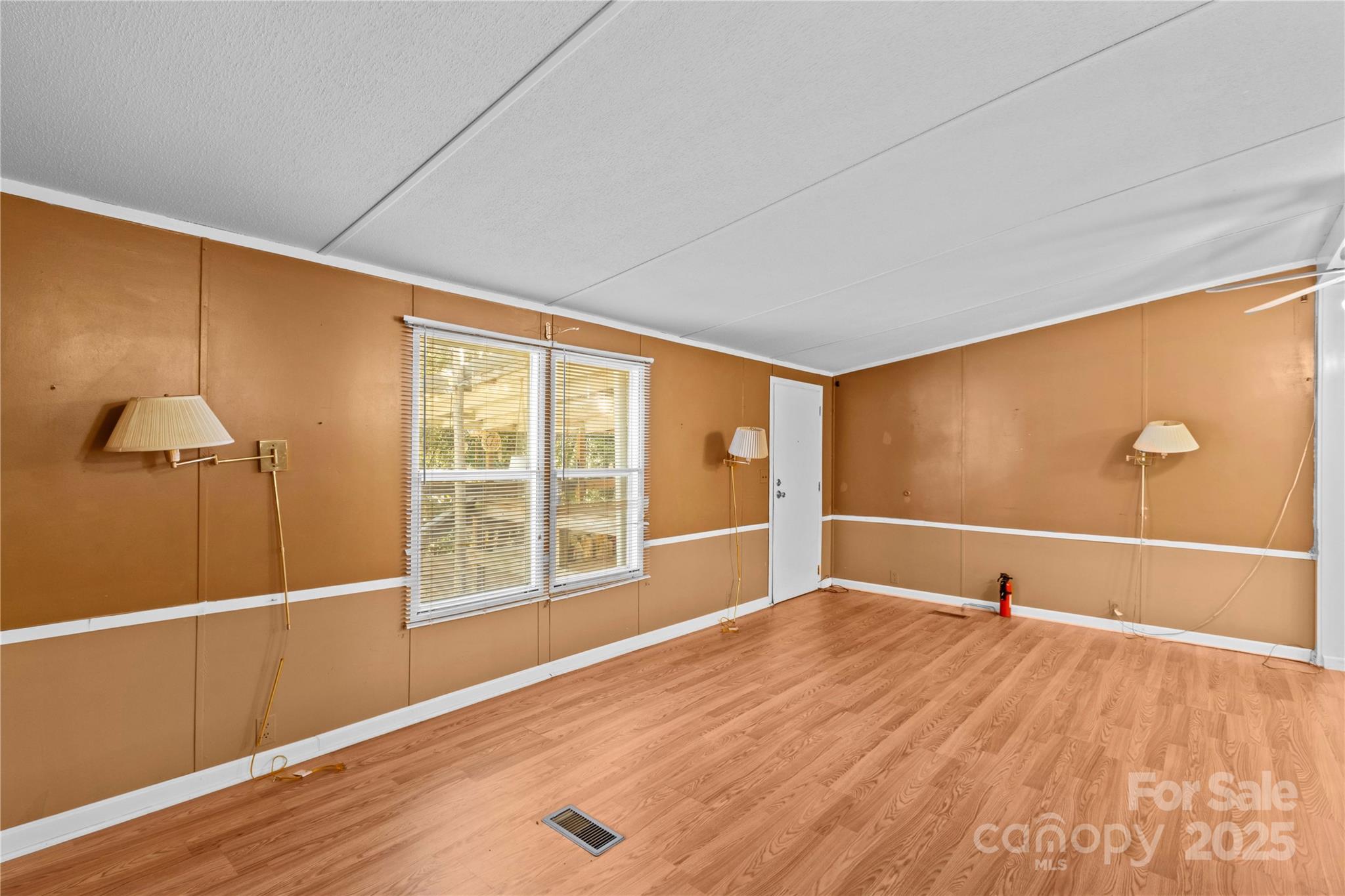 174 Ranch Way Mocksville, NC 27028 - Photo 8 of 27 a view of a room with wooden floor and windows
