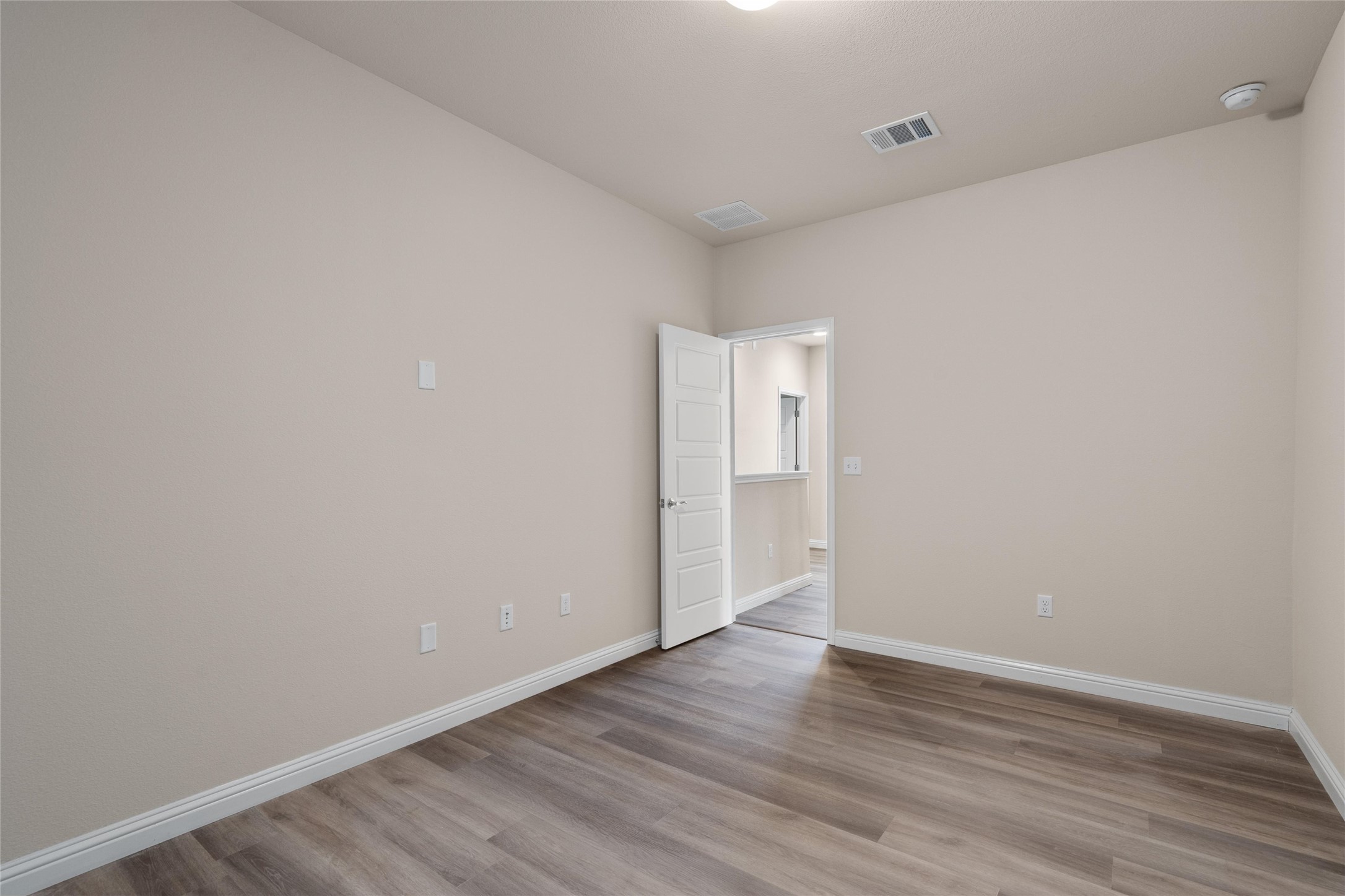 6907 Idea Road Austin, TX 78741 - Photo 20 of 36 a view of an empty room with wooden floor