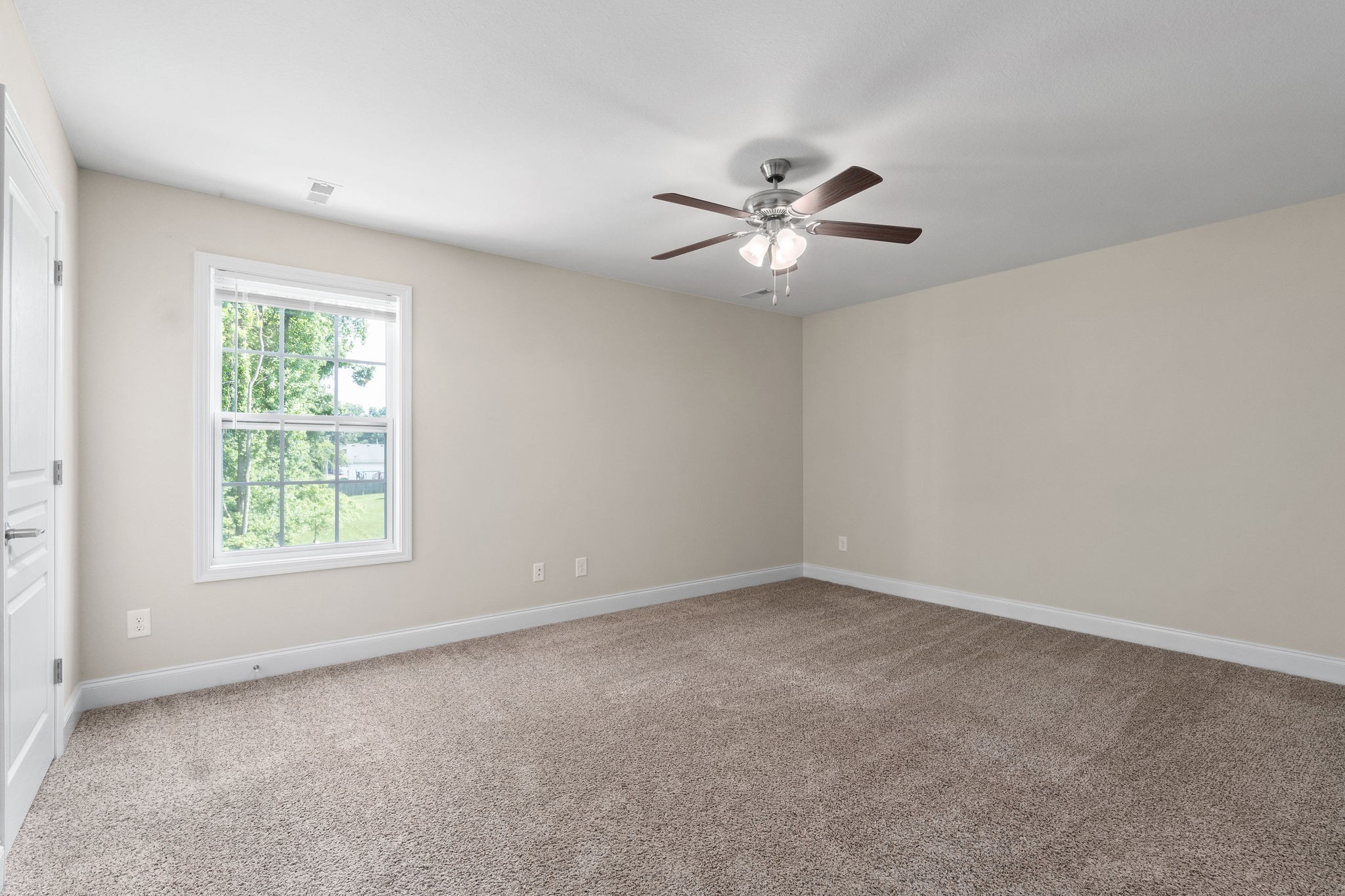 1552 Tylertown Road, Unit 104 Clarksville, TN 37040 - Photo 20 of 21 an empty room with a window and a fan