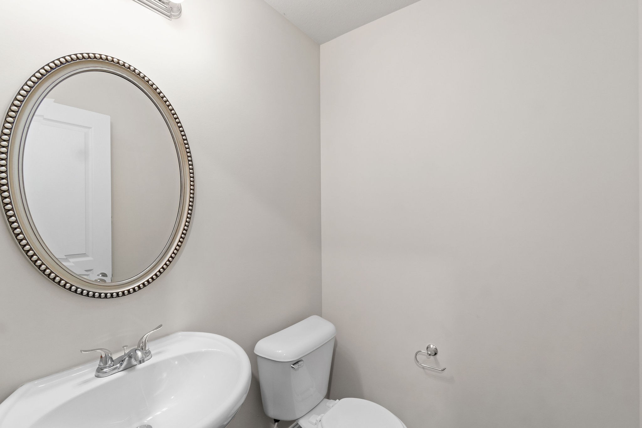 1552 Tylertown Road, Unit 104 Clarksville, TN 37040 - Photo 5 of 21 a bathroom with a toilet mirror a sink and a mirror