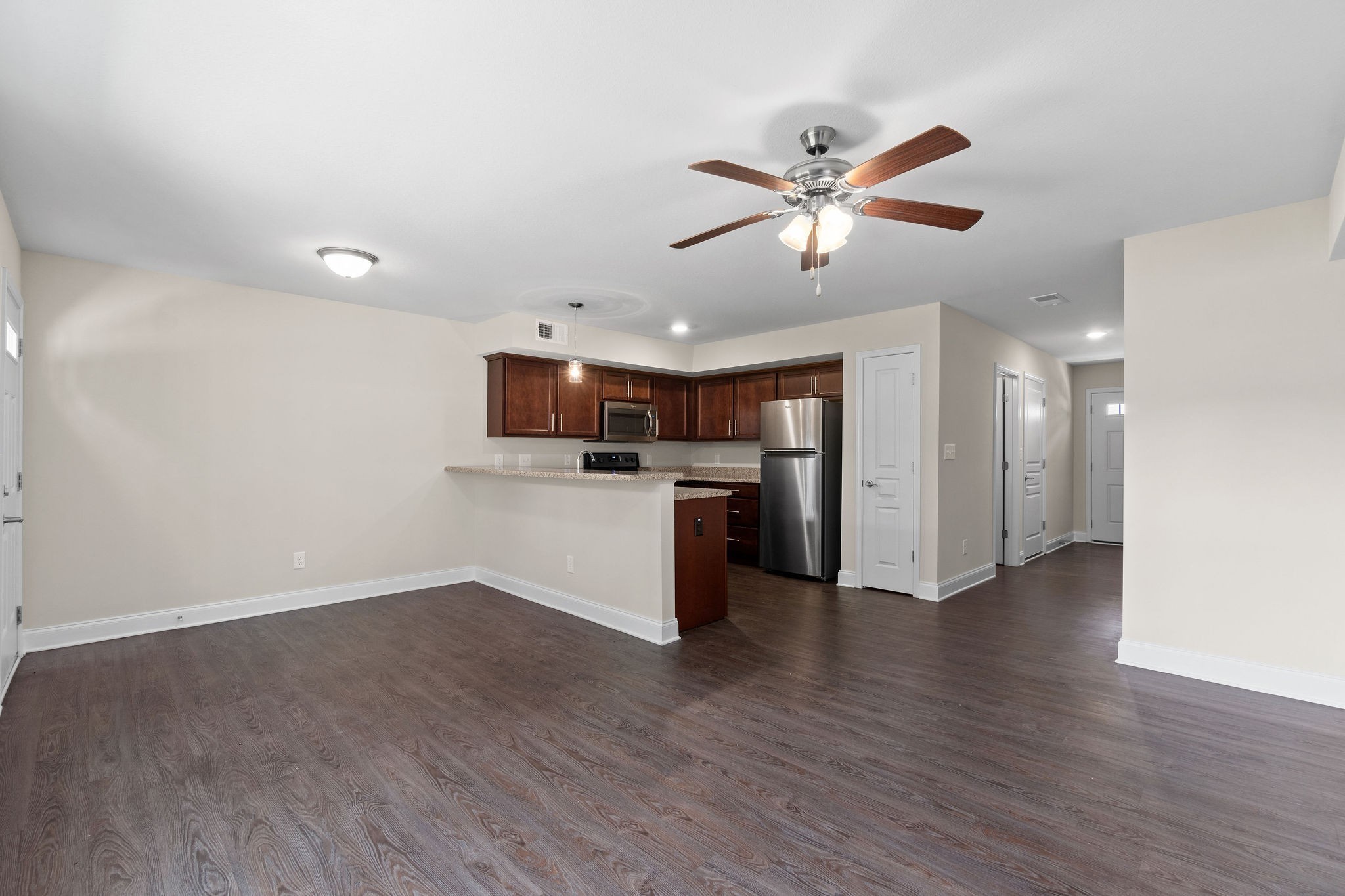 1552 Tylertown Road, Unit 104 Clarksville, TN 37040 - Photo 6 of 21 a view of a kitchen with a sink and a refrigerator