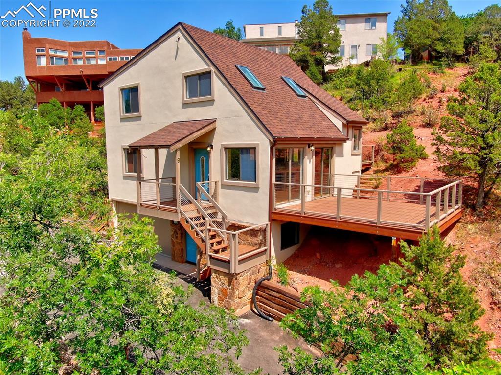 an aerial view of a house with swimming pool