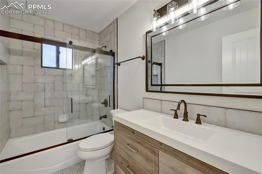 9 Sutherland Road Manitou Springs, CO 80829 - Photo 18 of 31 a bathroom with a sink a toilet and shower