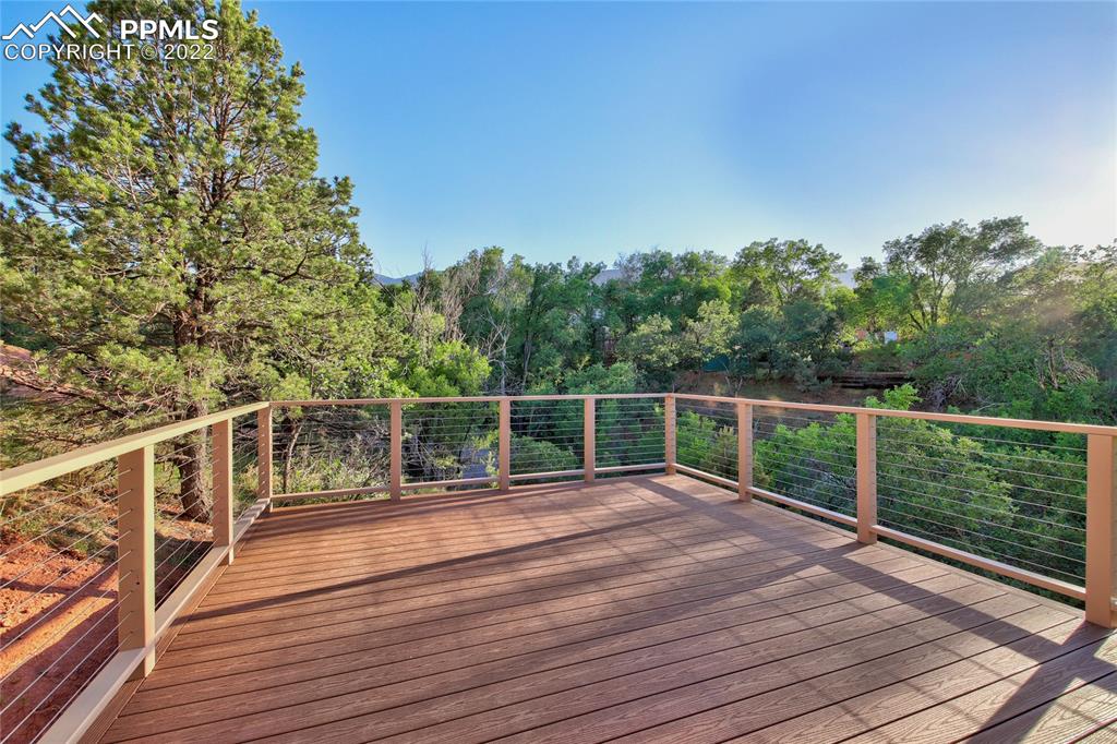 9 Sutherland Road Manitou Springs, CO 80829 - Photo 27 of 31 a view of a balcony with wooden floor and fence