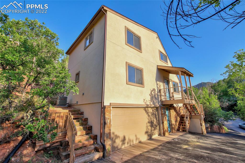 9 Sutherland Road Manitou Springs, CO 80829 - Photo 5 of 31 a view of a house with a street