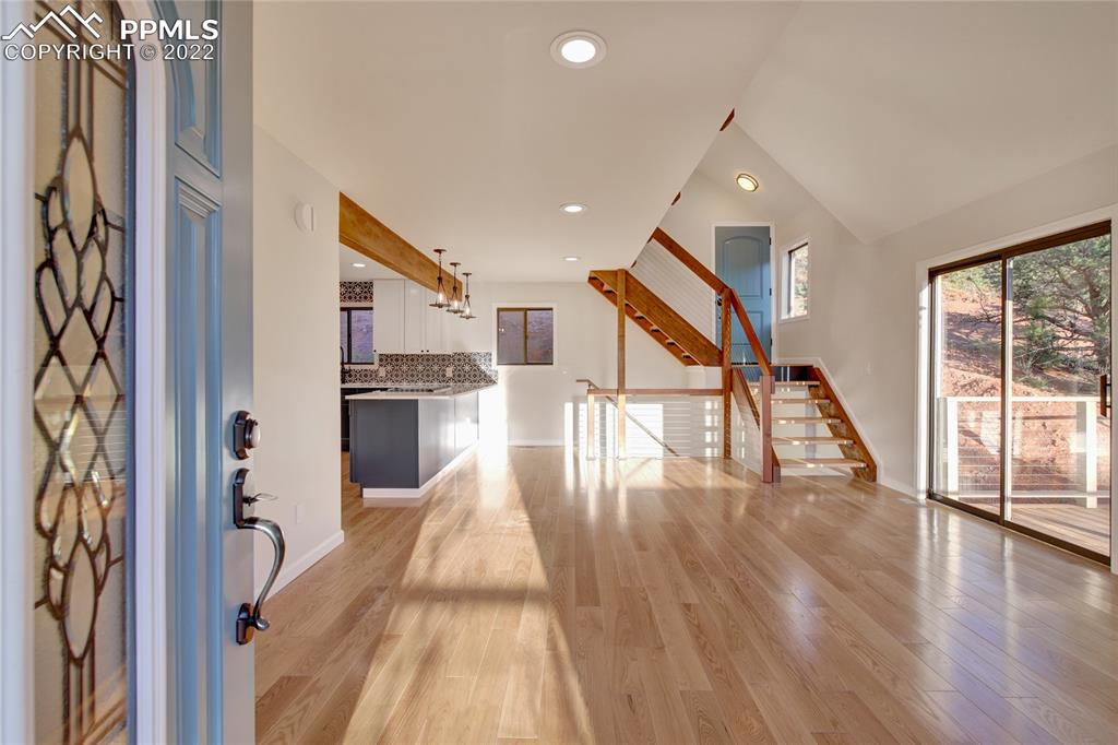 9 Sutherland Road Manitou Springs, CO 80829 - Photo 7 of 31 a view of a hallway with wooden floor and staircase