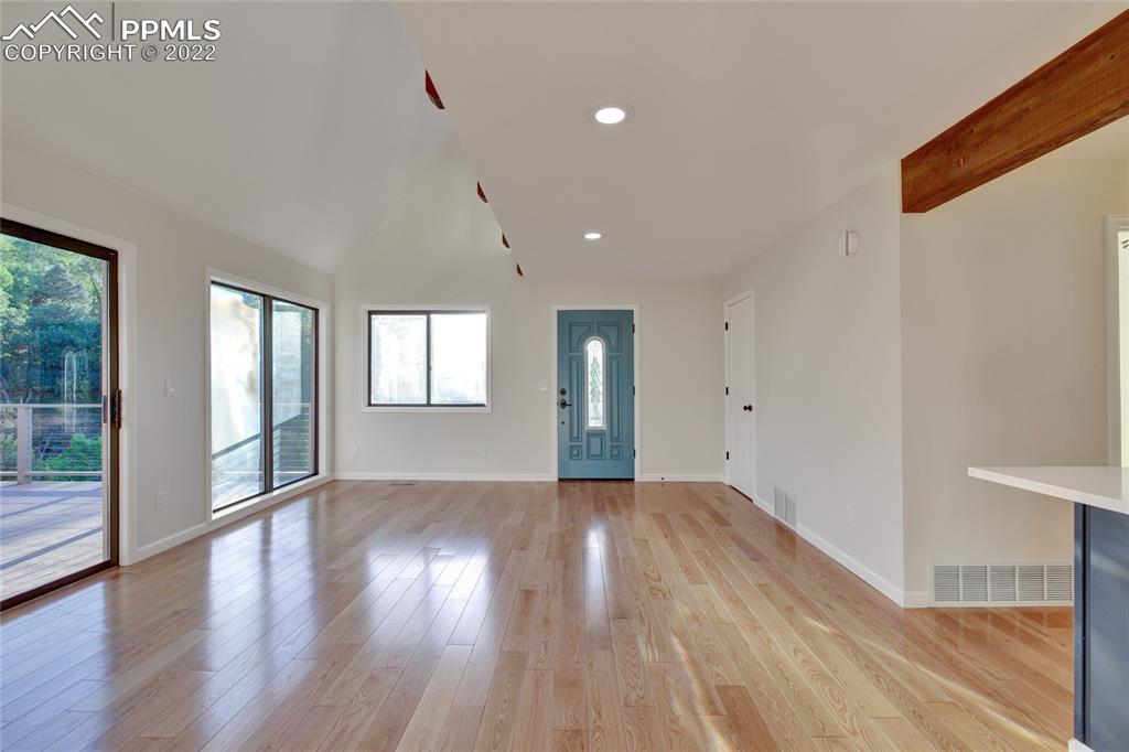 9 Sutherland Road Manitou Springs, CO 80829 - Photo 9 of 31 a view of an empty room with wooden floor and a window