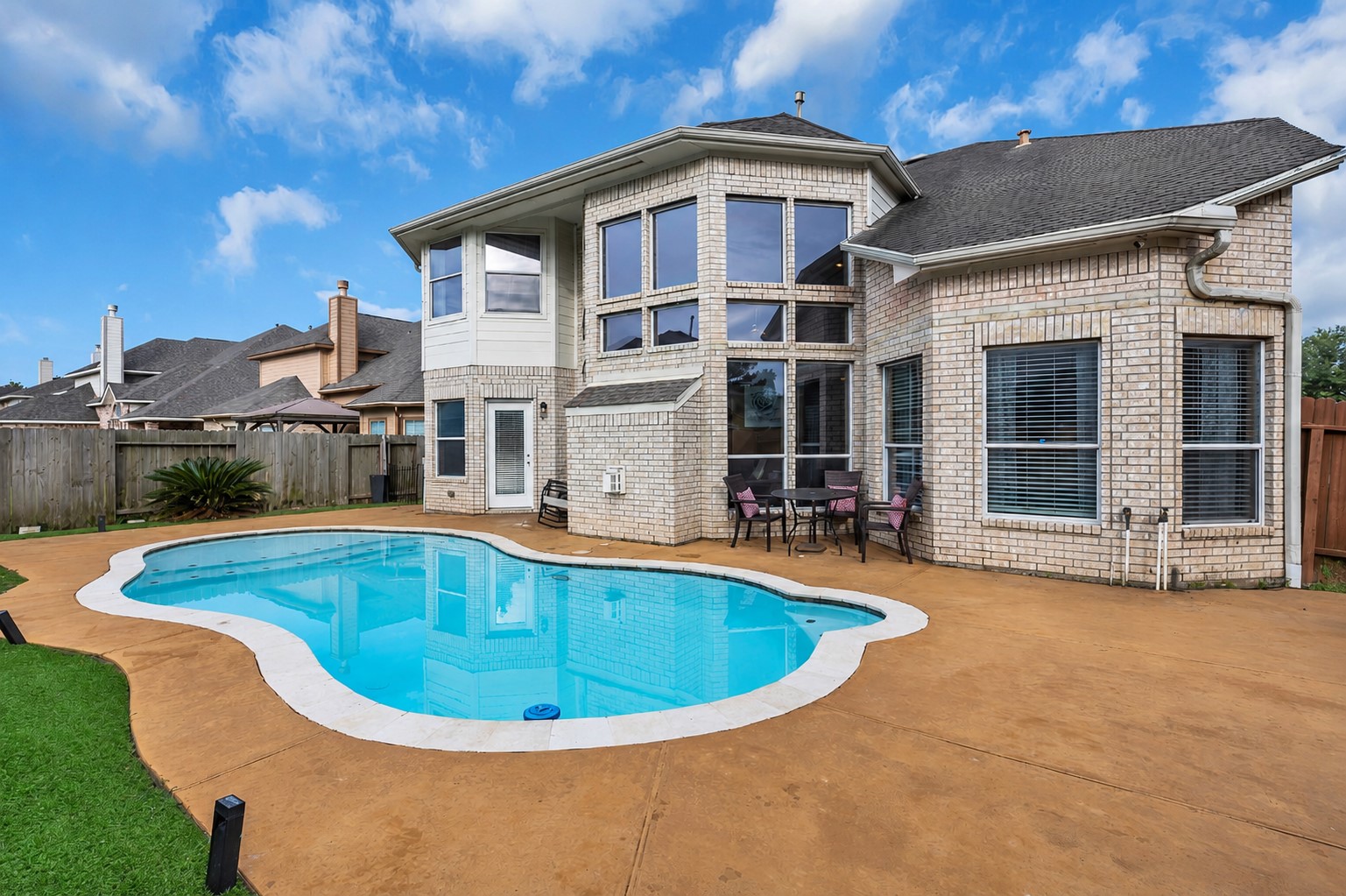 611 River Delta Lane Rosenberg, TX 77469 - Photo 37 of 39 a view of a house with swimming pool and porch