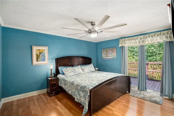 a bedroom with a large bed and a large window