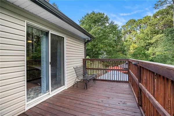 a view of a balcony with wooden floor