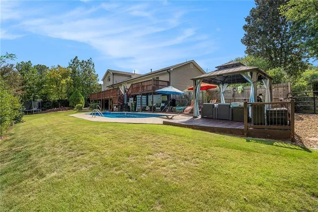 swimming pool view with a outdoor seating