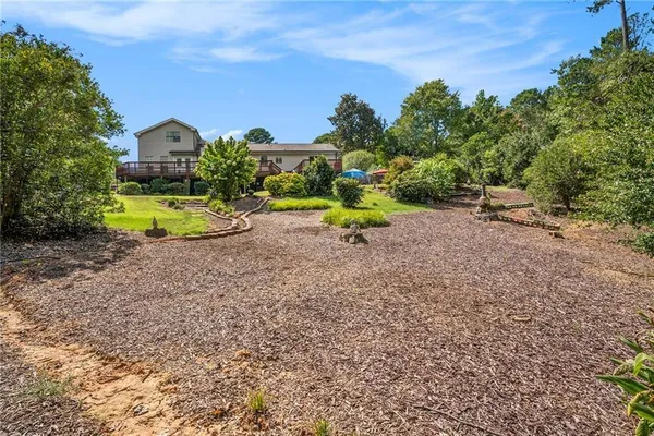 a view of backyard with a garden and entertaining space