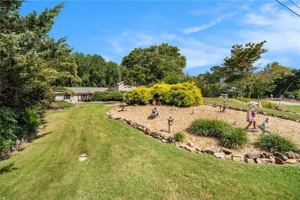 a view of a yard with an outdoor space