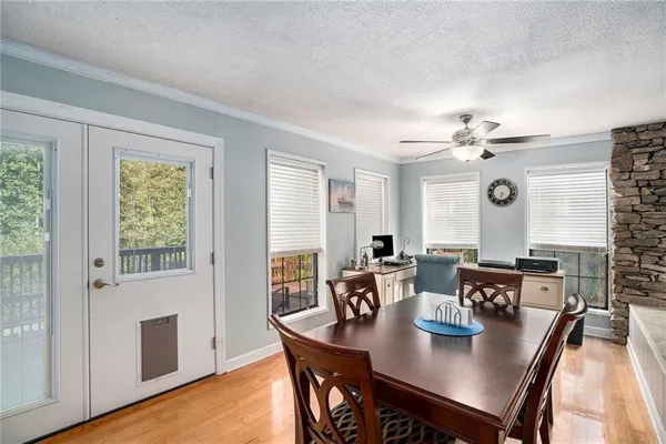 a view of a dining room with furniture and wooden floor