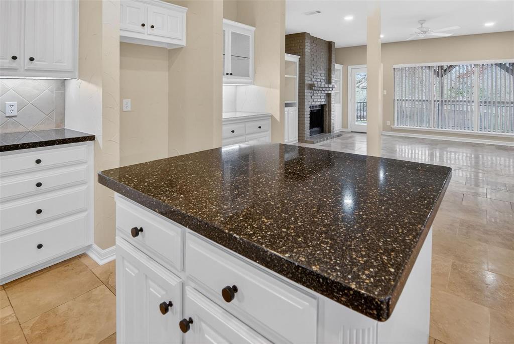 2122 Clear Lake Road Weatherford, TX 76087 - Photo 5 of 31 a kitchen with stainless steel appliances granite countertop a sink stove and cabinets