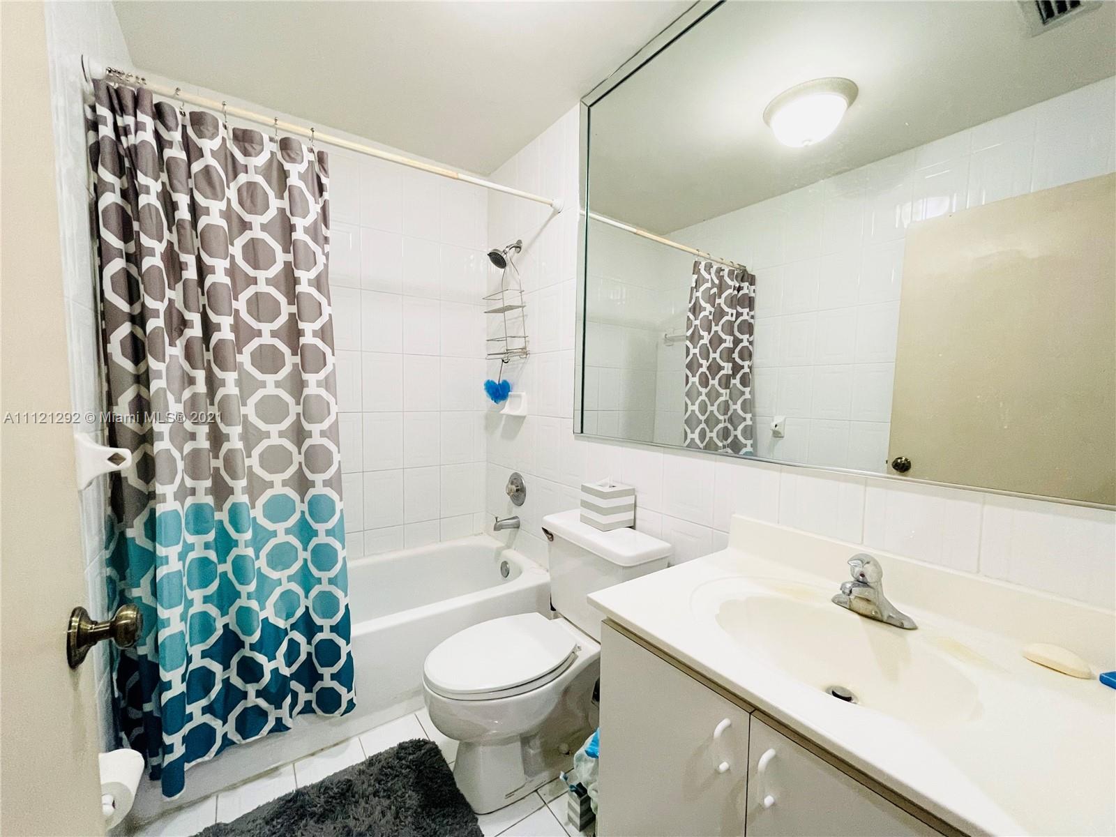 1245 Southwest 143rd Place Miami, FL 33184 - Photo 13 of 23 a bathroom with a sink toilet and shower