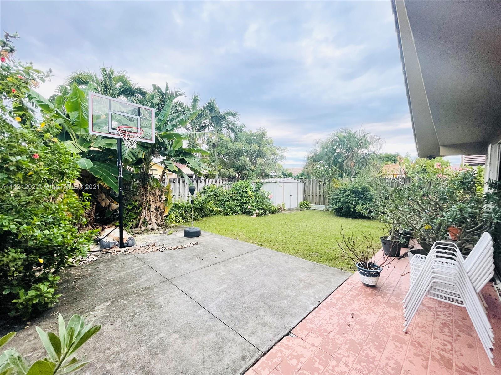 1245 Southwest 143rd Place Miami, FL 33184 - Photo 19 of 23 a view of a backyard