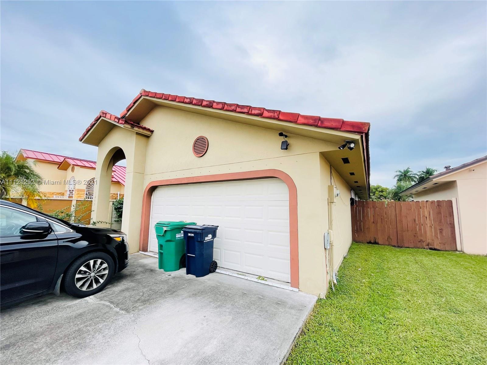 1245 Southwest 143rd Place Miami, FL 33184 - Photo 3 of 23 a view of a car garage