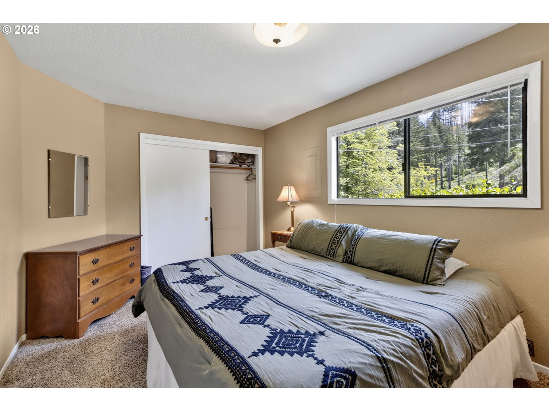 46725 Goodpasture Road Vida, OR 97488 - Photo 21 of 48 a bedroom with a large bed and a dresser