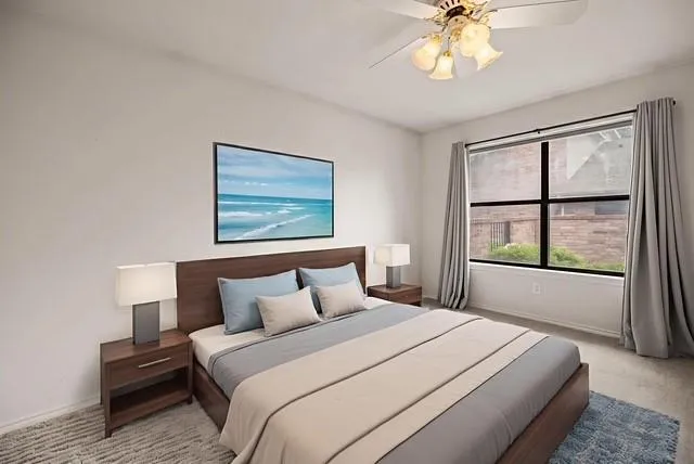 a spacious bathroom with a granite countertop sink mirror and toilet