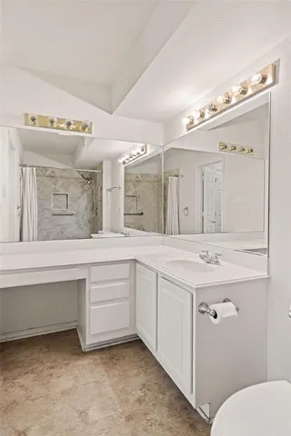 a bathroom view of a toilet and a shower
