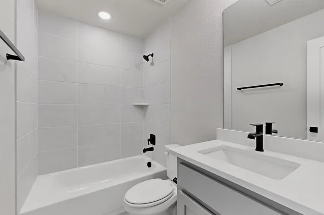 a kitchen with stainless steel appliances a sink a window and cabinets