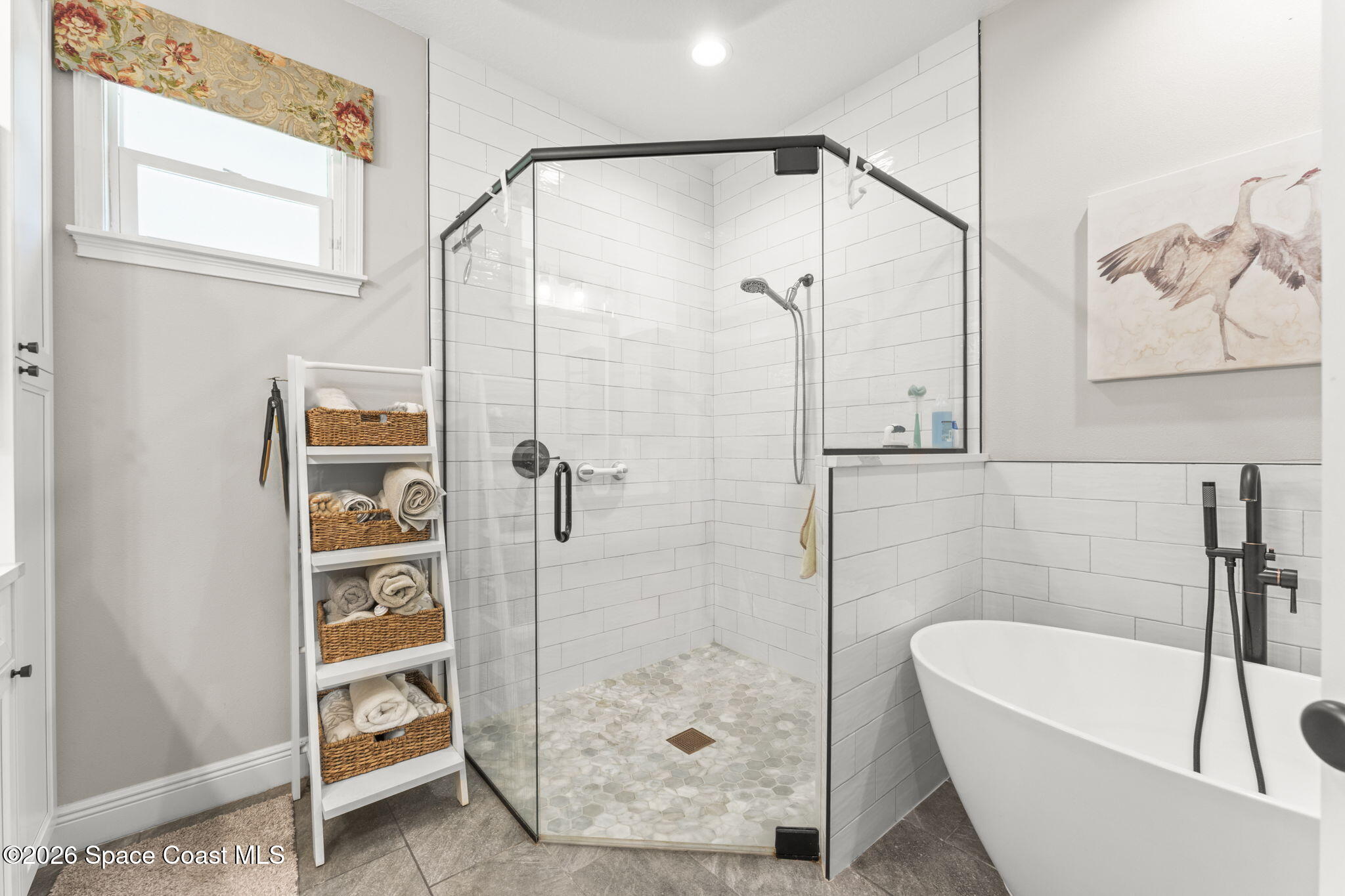 1740 Ford Road Mims, FL 32754 - Photo 24 of 43 a bathroom with a tub a toilet and a shower