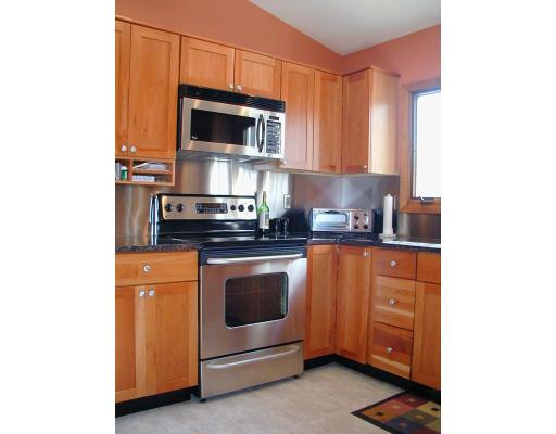 131 Town Farm Road Monson, MA 01057 - Photo 3 of 12 a kitchen with stainless steel appliances a stove microwave and sink