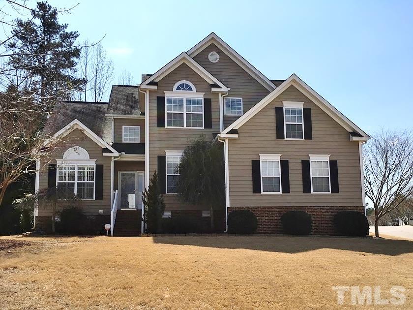 101 Mickleson Ridge Drive Raleigh, NC 27603 - Photo 23 of 25 a front view of a house with a yard