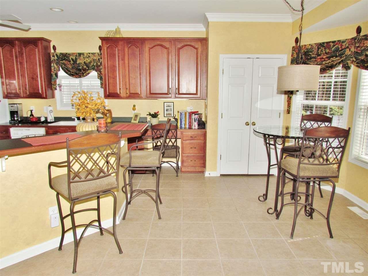 101 Mickleson Ridge Drive Raleigh, NC 27603 - Photo 8 of 25 a view of a dining room with furniture