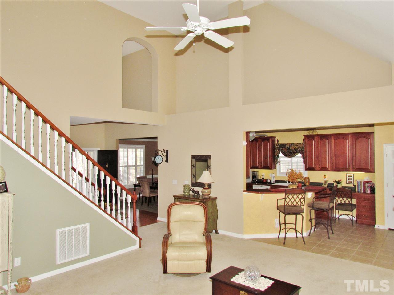 101 Mickleson Ridge Drive Raleigh, NC 27603 - Photo 25 of 25 a dining room with furniture and a chandelier