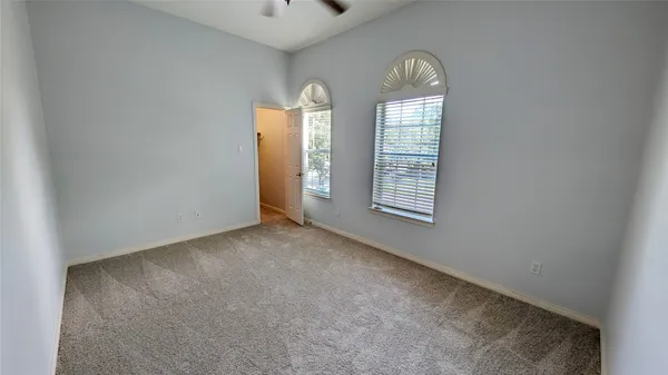 an empty room with windows mirror and windows