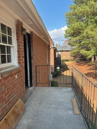a view of a balcony with outdoor seating