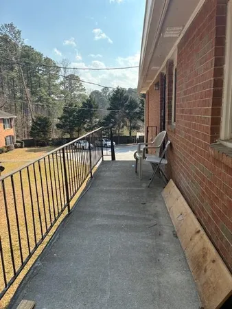 a view of balcony and car parked