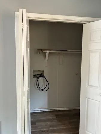 a view of a storage & utility room with wooden floor