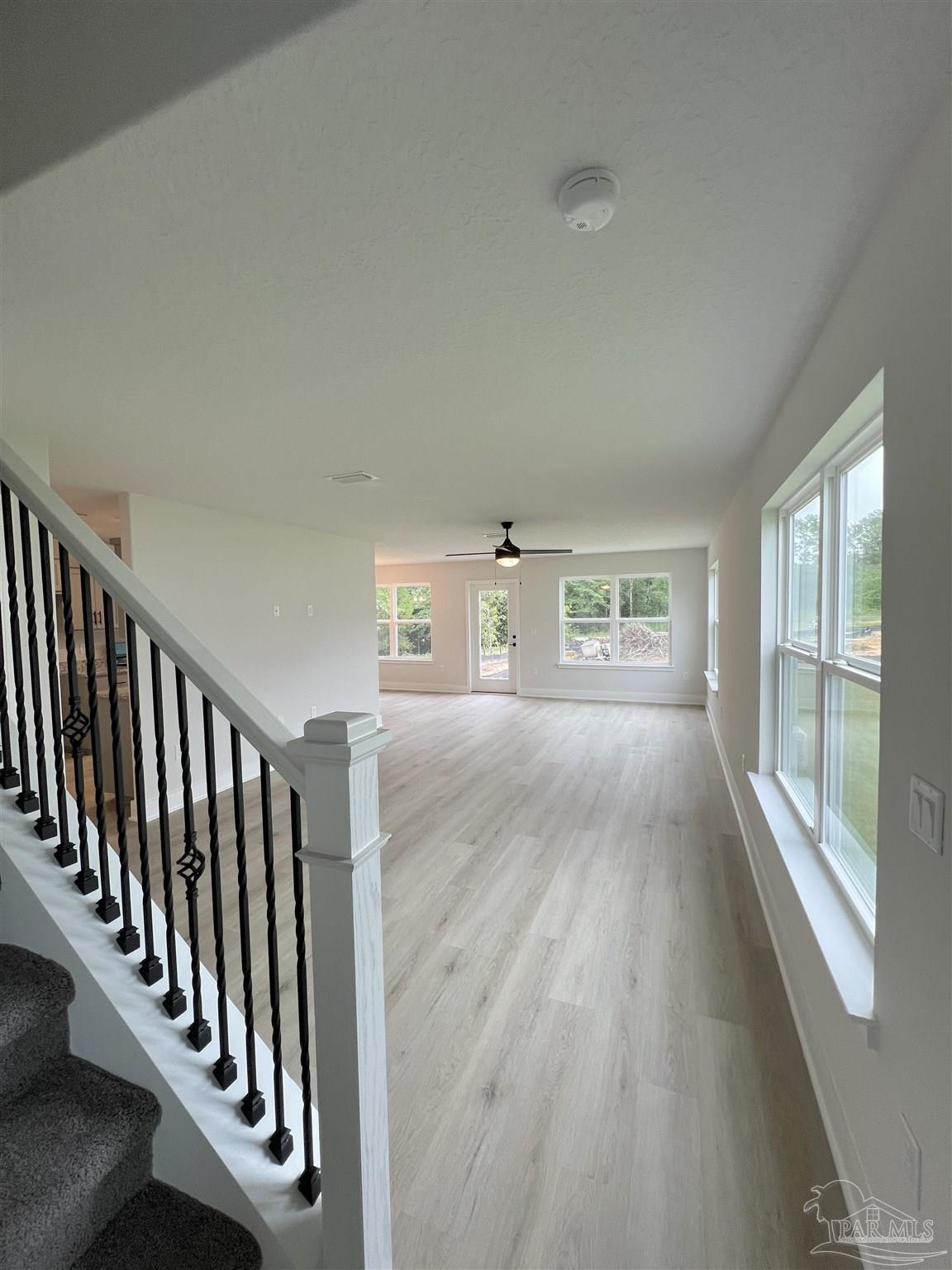 944 Rustling Pnes Road, Unit 12B Cantonment, FL 32533 - Photo 3 of 16 a view of entryway with wooden floor