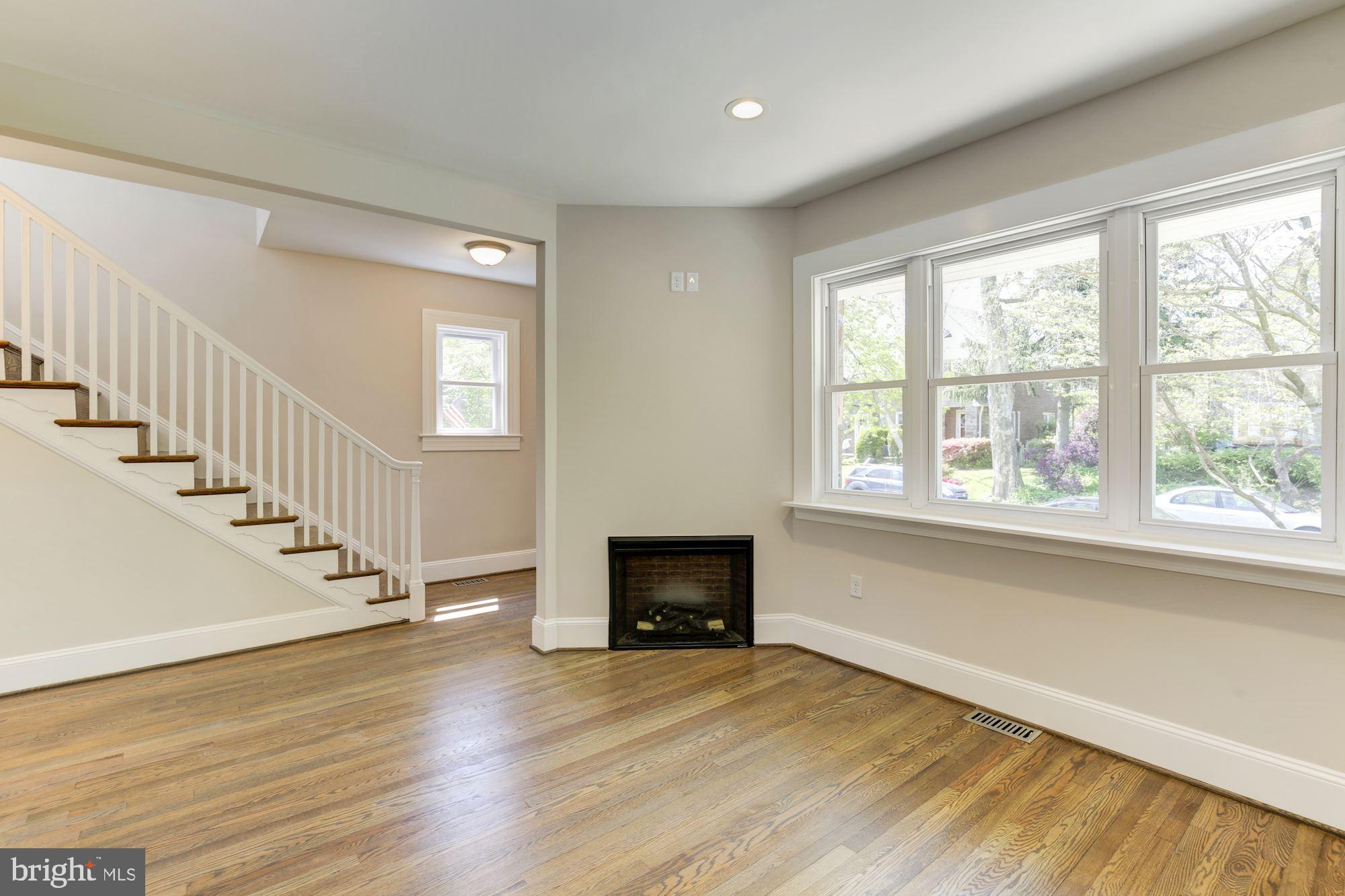 406 Hopkins Road Baltimore, MD 21212 - Photo 14 of 52 Gas fireplace with tv area above.