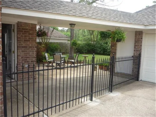 a view of a balcony with floor to ceiling window and wooden floor