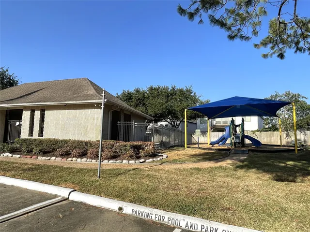 a backyard of a house with yard and outdoor seating