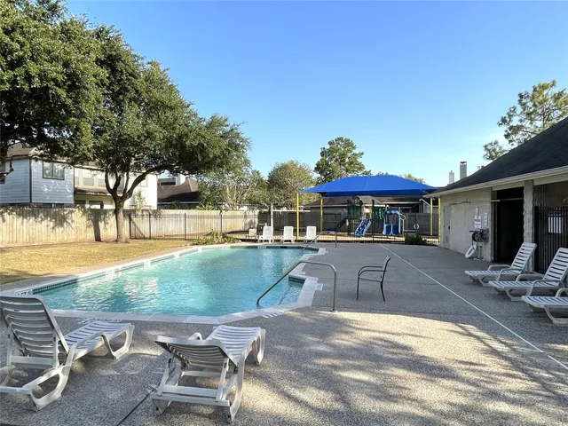 a view of pool with outdoor seating