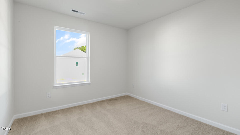 32 Red Clover Drive Angier, NC 27501 - Photo 18 of 38 an empty room with a window