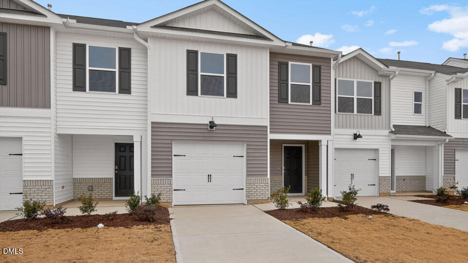 32 Red Clover Drive Angier, NC 27501 - Photo 2 of 38 a front view of a house with yard