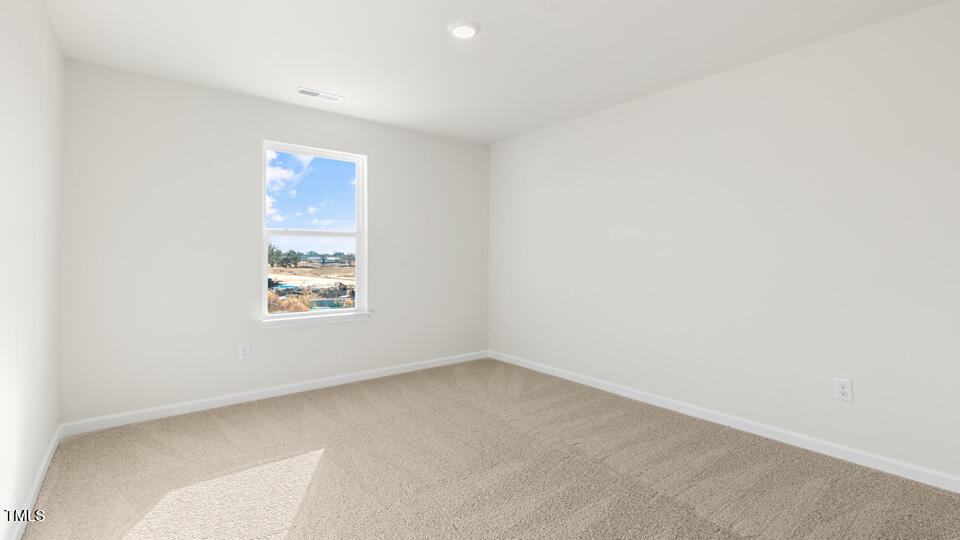 32 Red Clover Drive Angier, NC 27501 - Photo 24 of 38 an empty room with a window